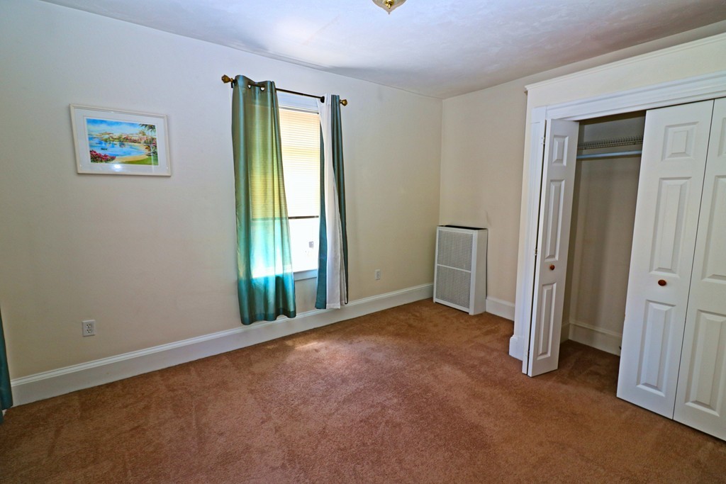 53 Trident Avenue, Unit 103 Winthrop, MA 02152 - Photo 16 of 16 an empty room with windows