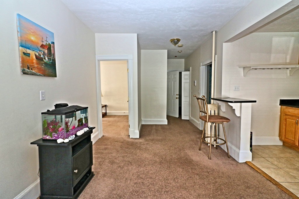 53 Trident Avenue, Unit 103 Winthrop, MA 02152 - Photo 8 of 16 a living room with furniture