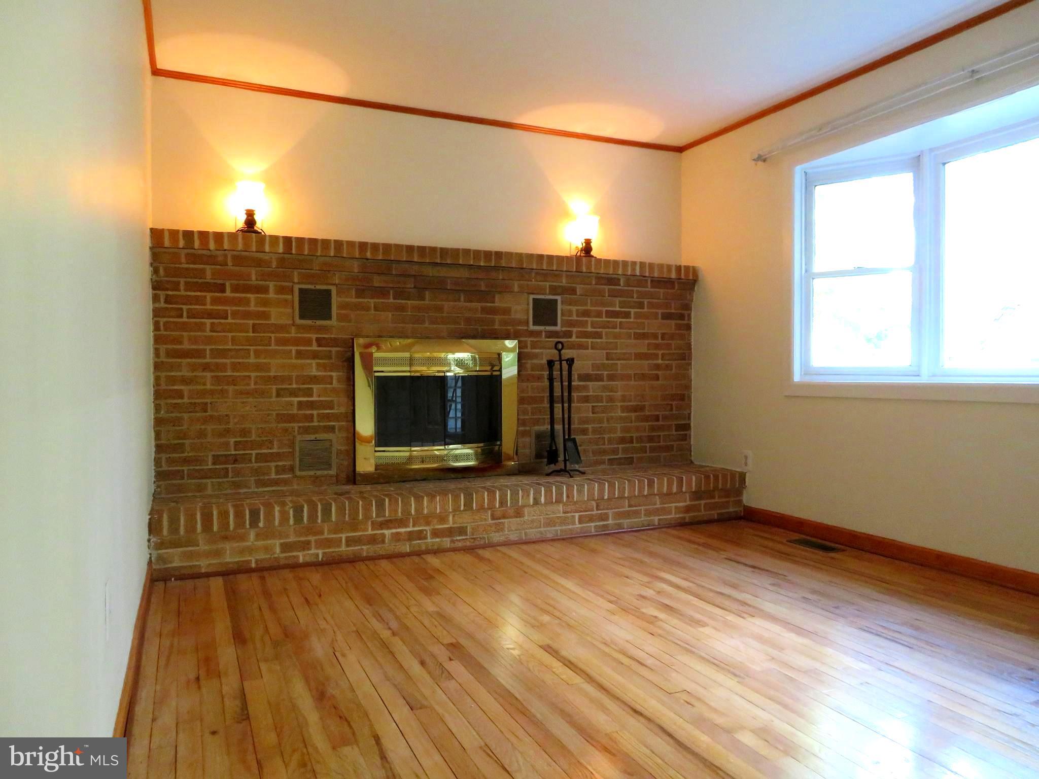 759 Principio Road Port Deposit, MD 21904 - Photo 8 of 49 Living Room with beautiful hardwood&hearth