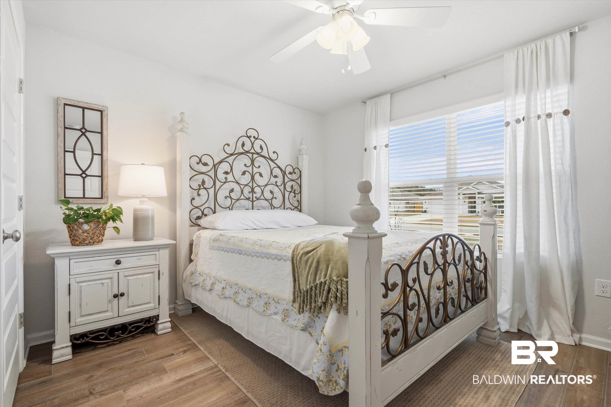17041 Muse Street Loxley, AL 36551 - Photo 21 of 44 Bedroom featuring light wood-style floors and ceiling fan