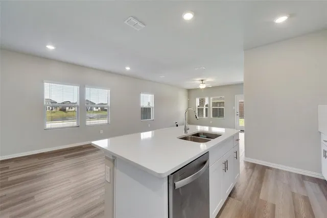 a kitchen with a sink stove and microwave