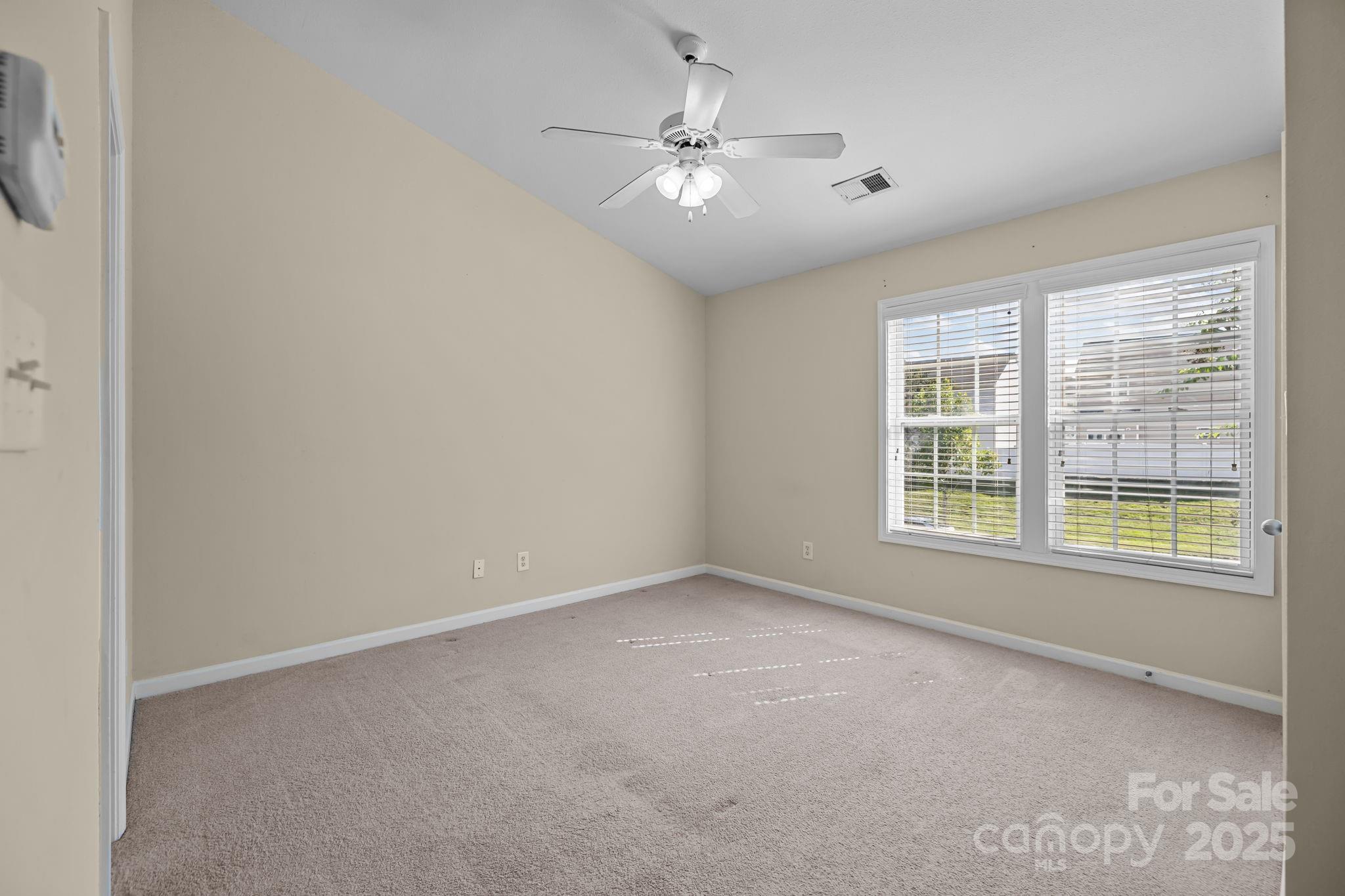 8809 Starnes Randall Road Charlotte, NC 28215 - Photo 14 of 28 a view of an empty room with a window