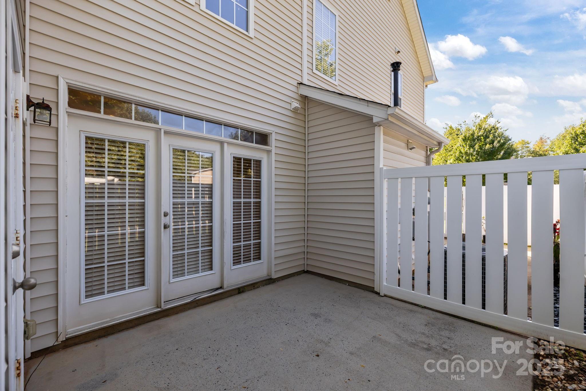 8809 Starnes Randall Road Charlotte, NC 28215 - Photo 20 of 28 a view of a house with wooden fence