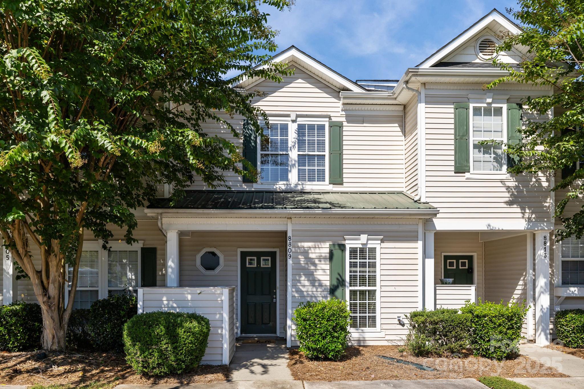 8809 Starnes Randall Road Charlotte, NC 28215 - Photo 2 of 28 a front view of a house with garden