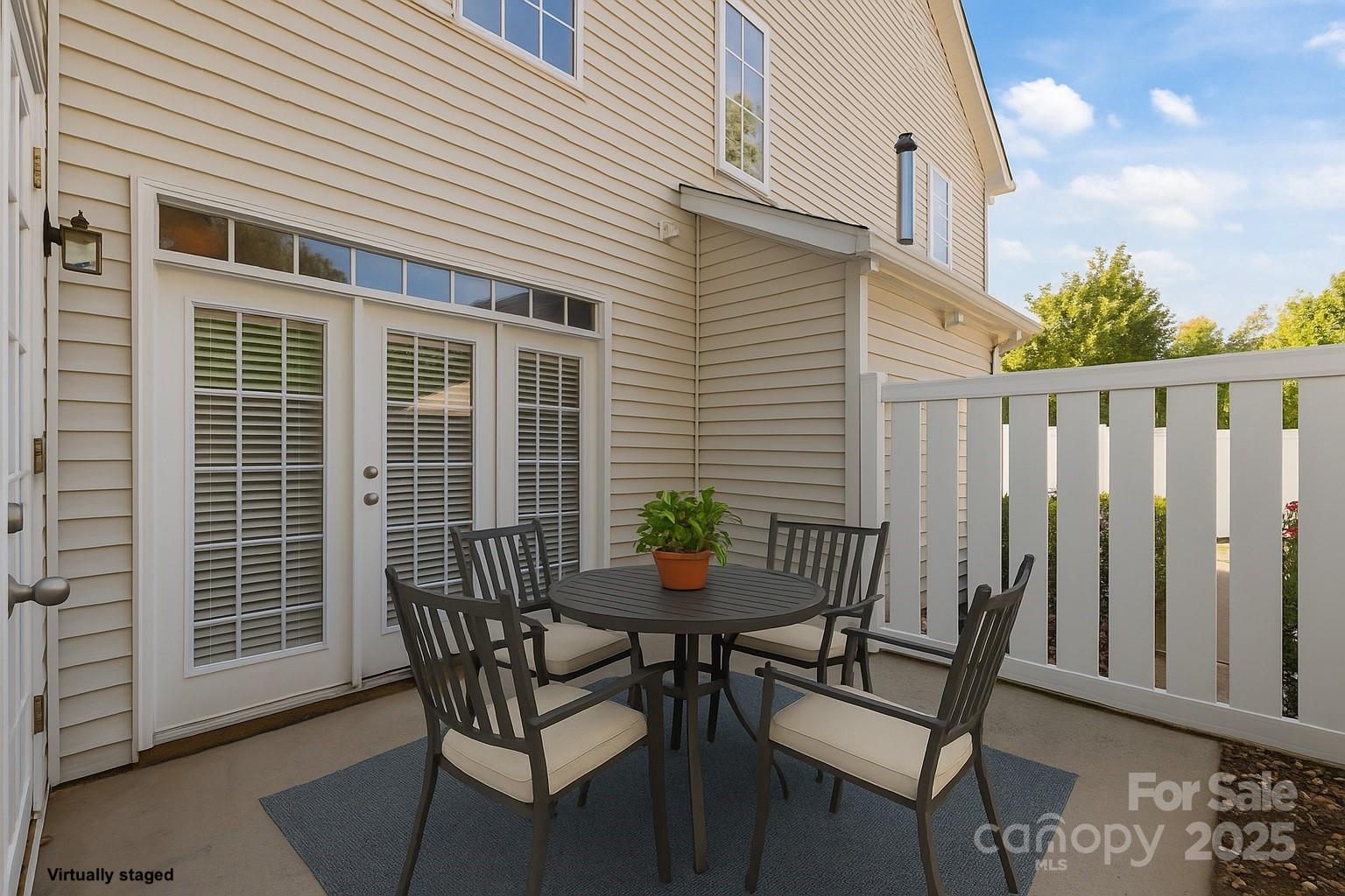 8809 Starnes Randall Road Charlotte, NC 28215 - Photo 21 of 28 a view of a chair and table in the back yard