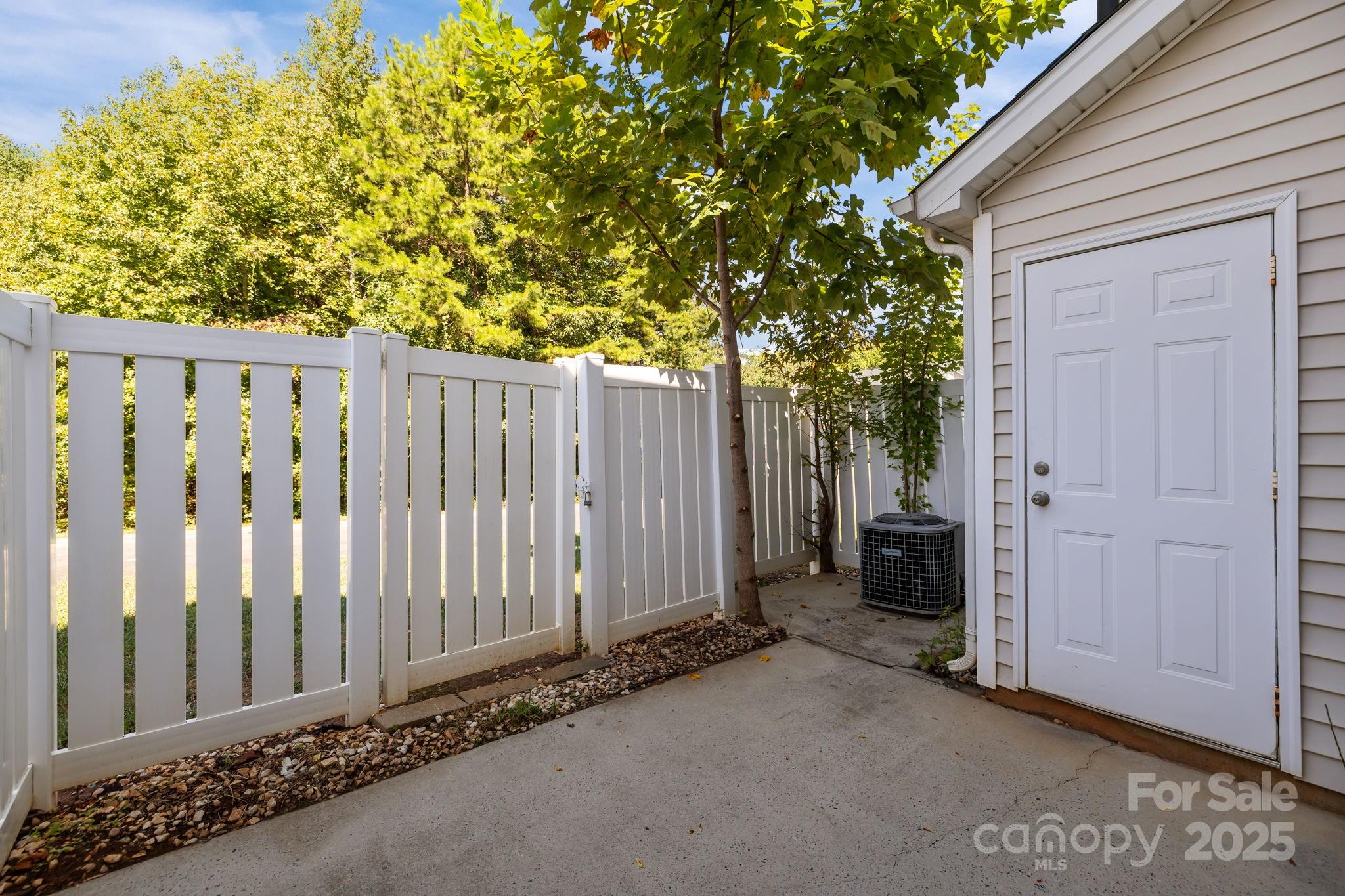 8809 Starnes Randall Road Charlotte, NC 28215 - Photo 22 of 28 a view of a house with a backyard