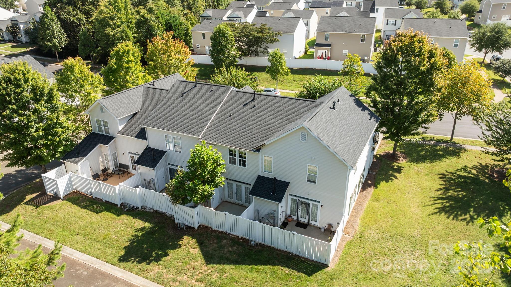 8809 Starnes Randall Road Charlotte, NC 28215 - Photo 23 of 28 an aerial view of a house with swimming pool and large trees
