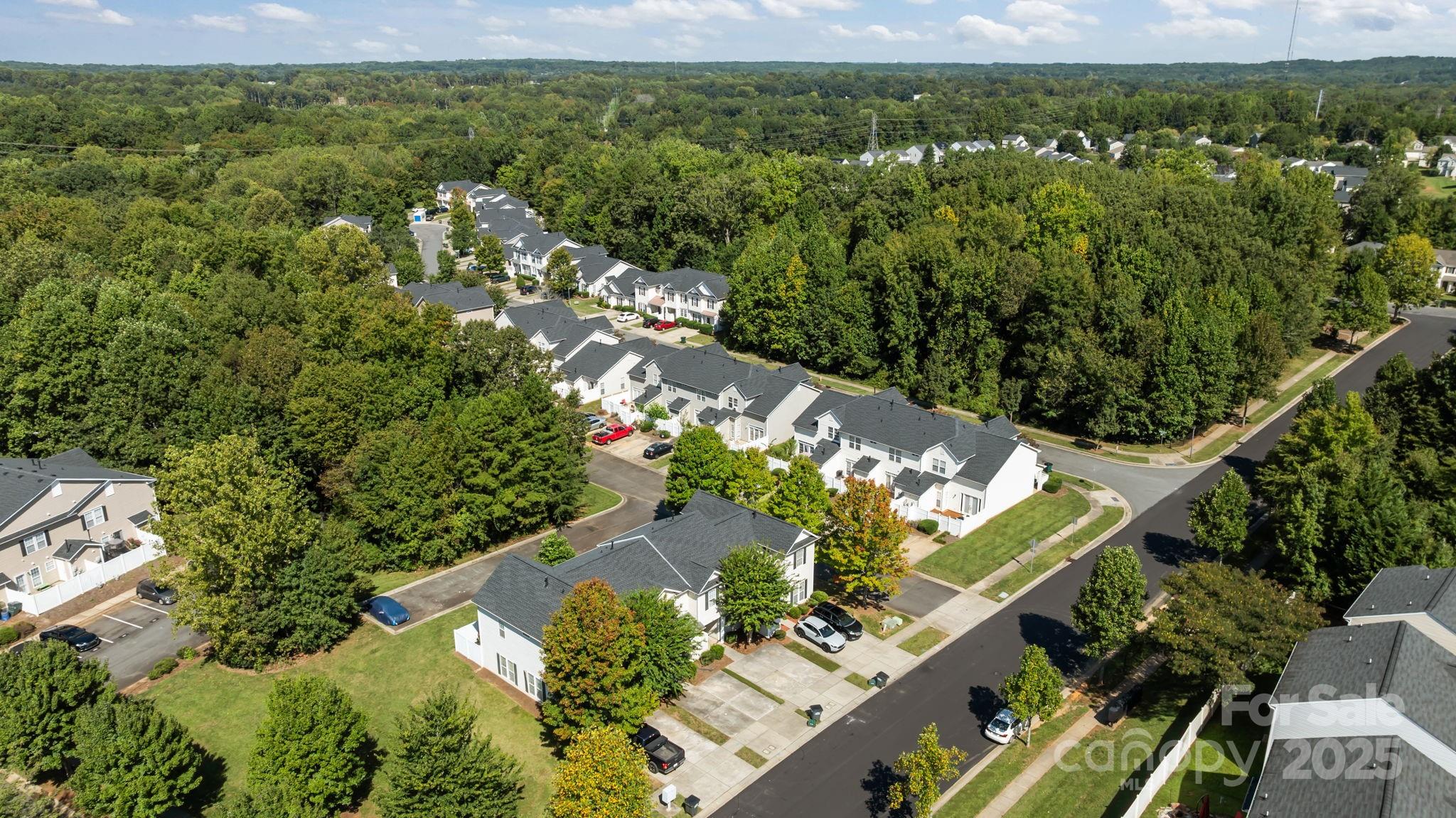 8809 Starnes Randall Road Charlotte, NC 28215 - Photo 25 of 28 an aerial view of a house with a yard and lake view