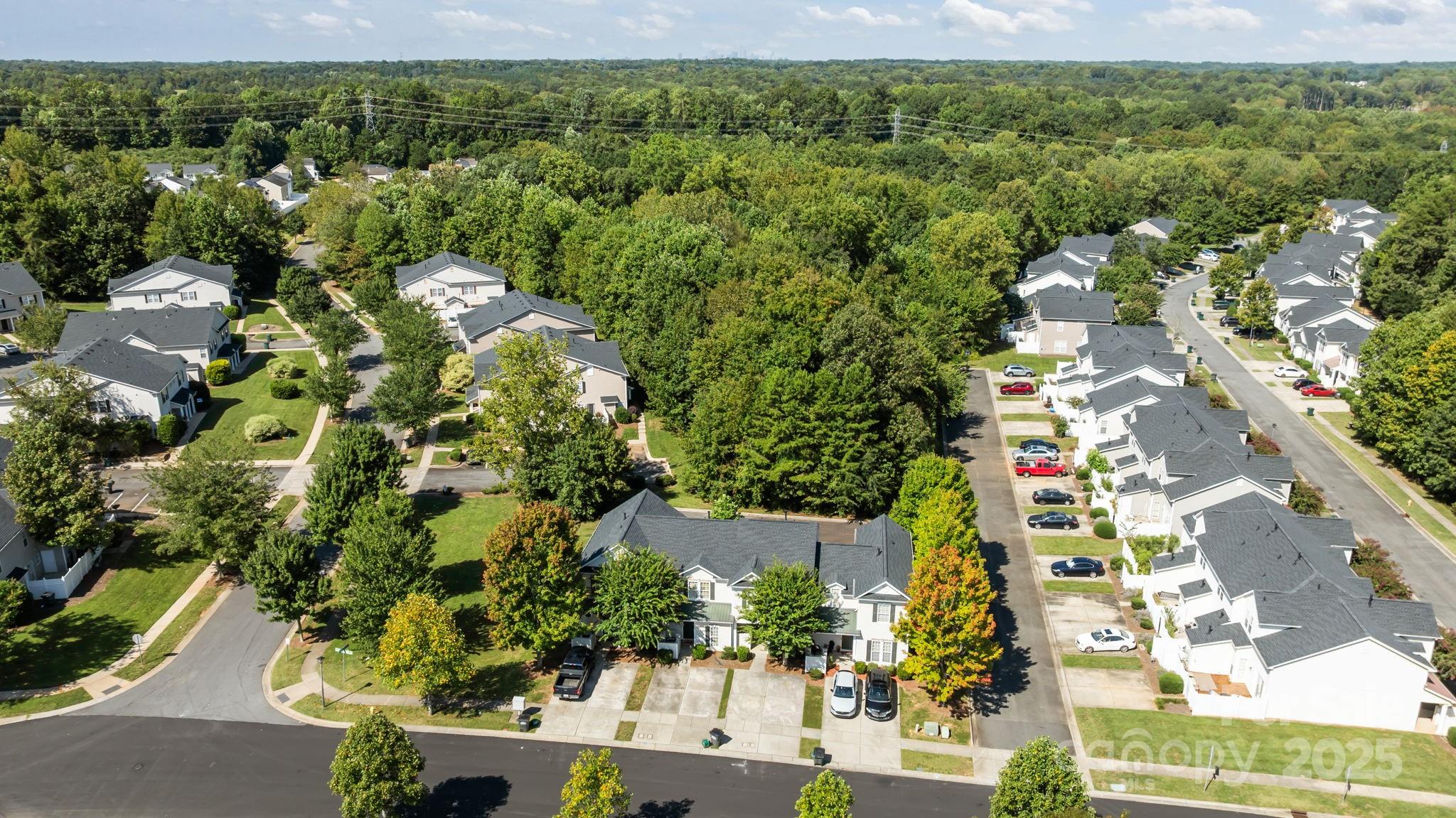8809 Starnes Randall Road Charlotte, NC 28215 - Photo 28 of 28 an aerial view of residential houses with outdoor space and trees