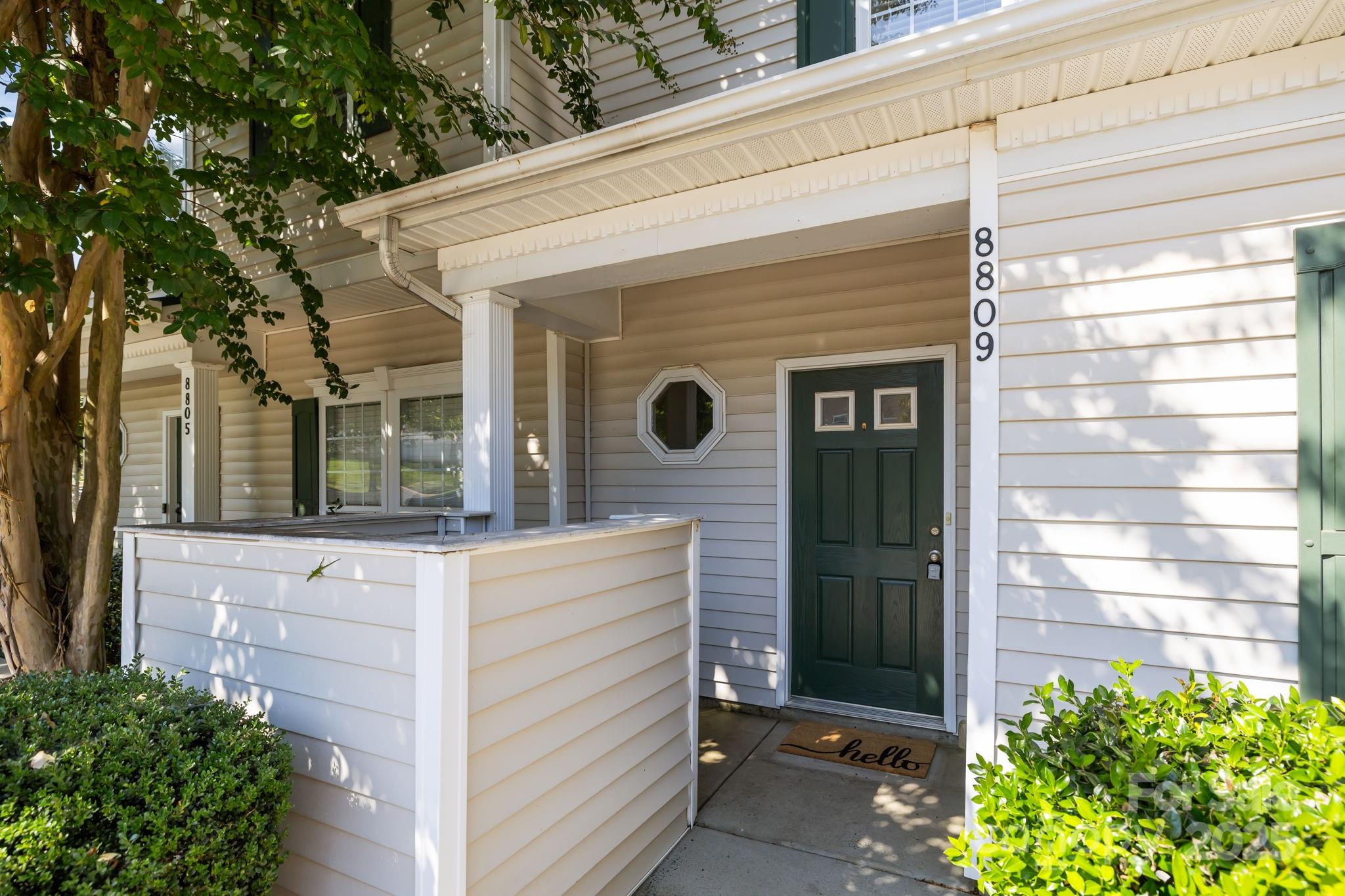 8809 Starnes Randall Road Charlotte, NC 28215 - Photo 3 of 28 a front view of a house with a yard