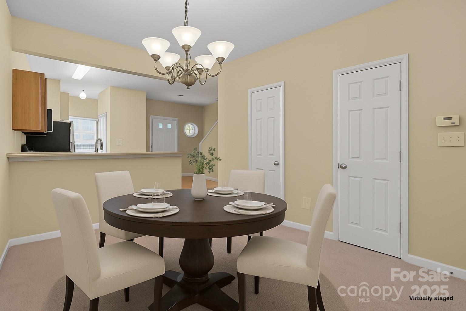 8809 Starnes Randall Road Charlotte, NC 28215 - Photo 9 of 28 a view of a dining room with a table and chairs
