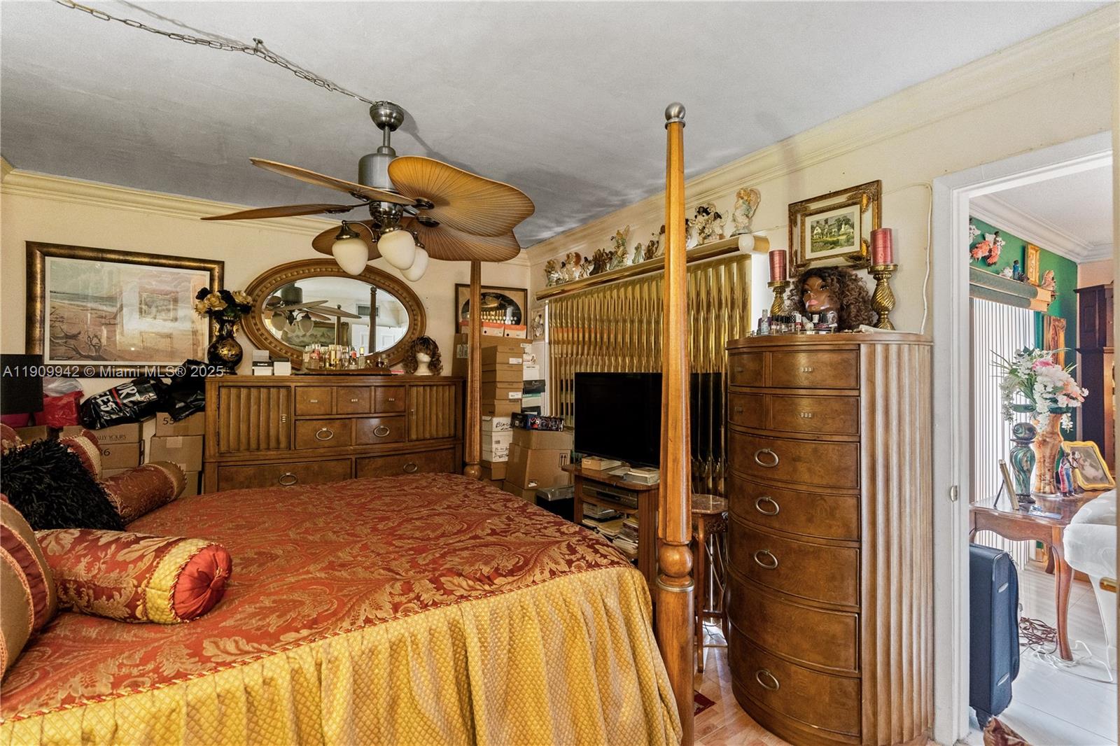 3199 Foxcroft Road, Unit 314 Miramar, FL 33025 - Photo 16 of 25 a bedroom with a bed a standing desk and chair