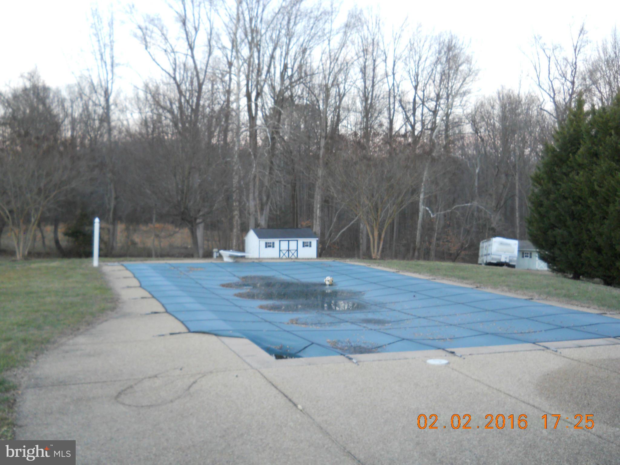 3405 Evans Road Huntingtown, MD 20639 - Photo 2 of 16 a view of outdoor space with sign board