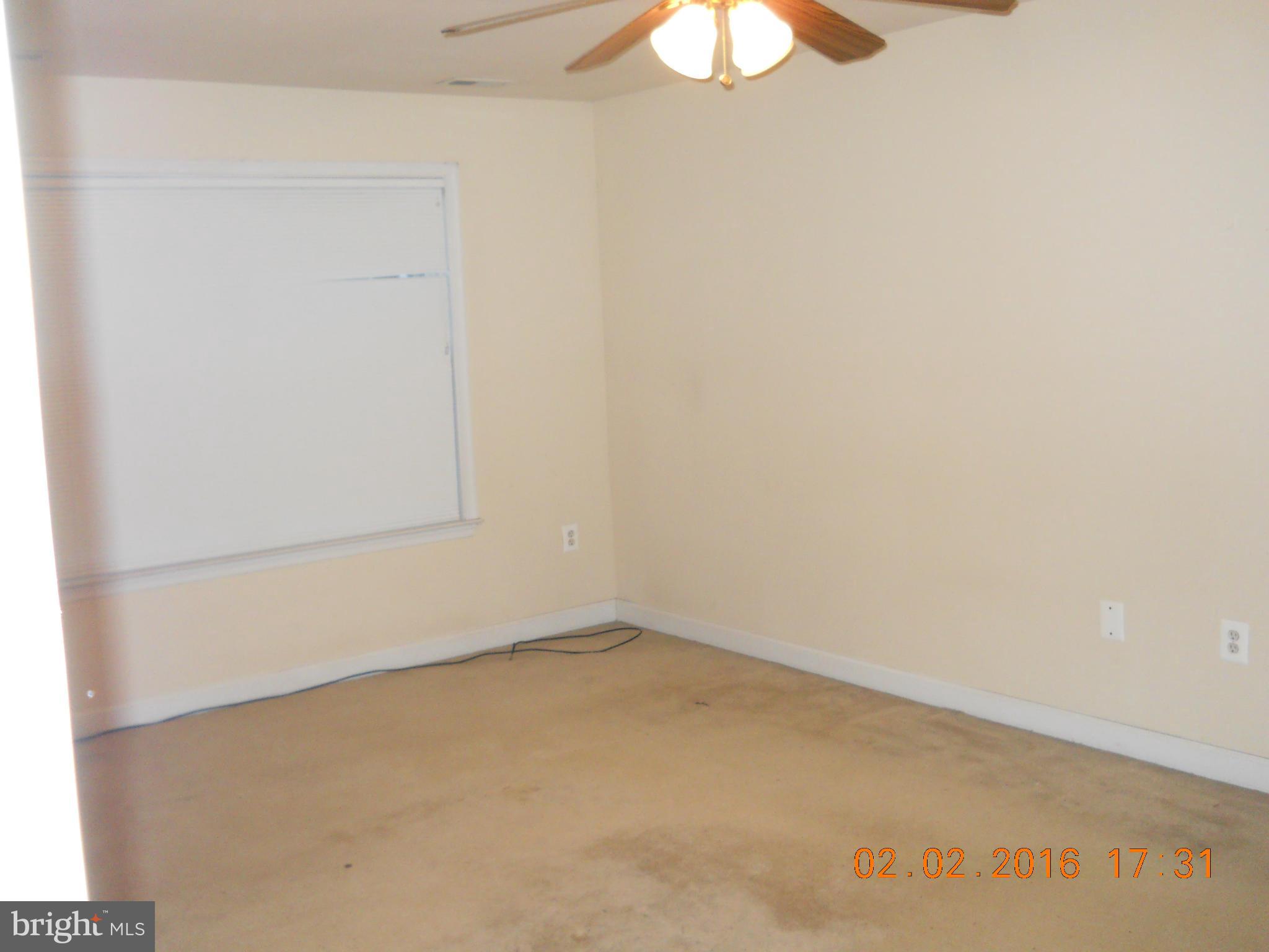 3405 Evans Road Huntingtown, MD 20639 - Photo 12 of 16 an empty room with a window