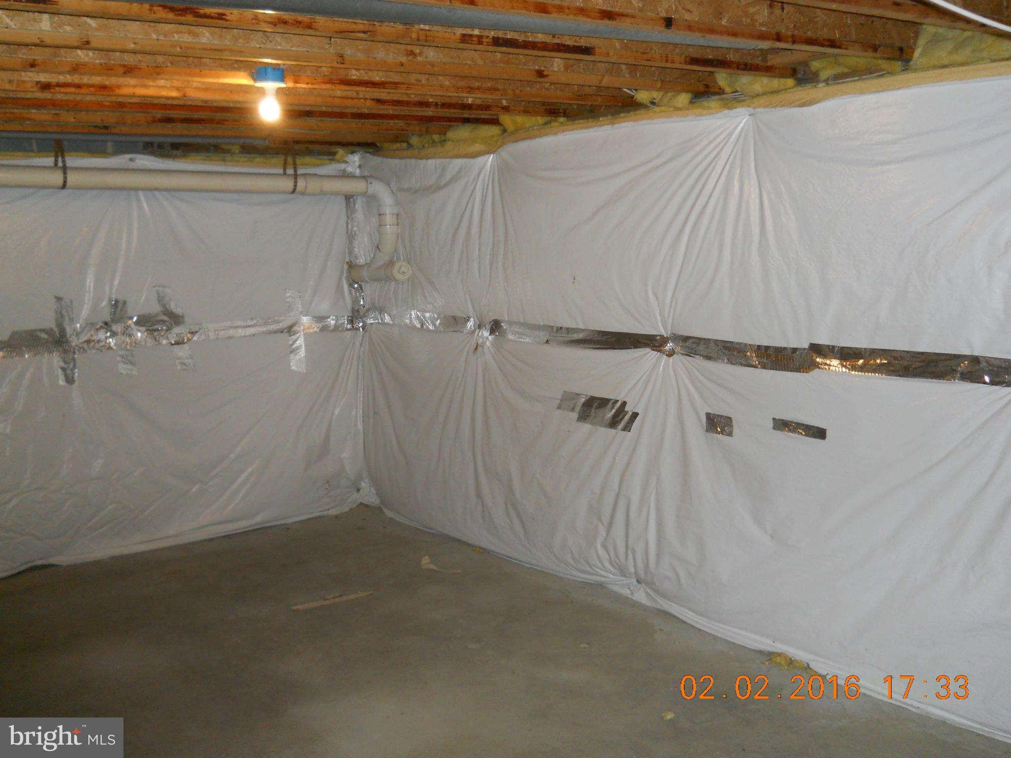 3405 Evans Road Huntingtown, MD 20639 - Photo 16 of 16 a view of a room with racks on the wall