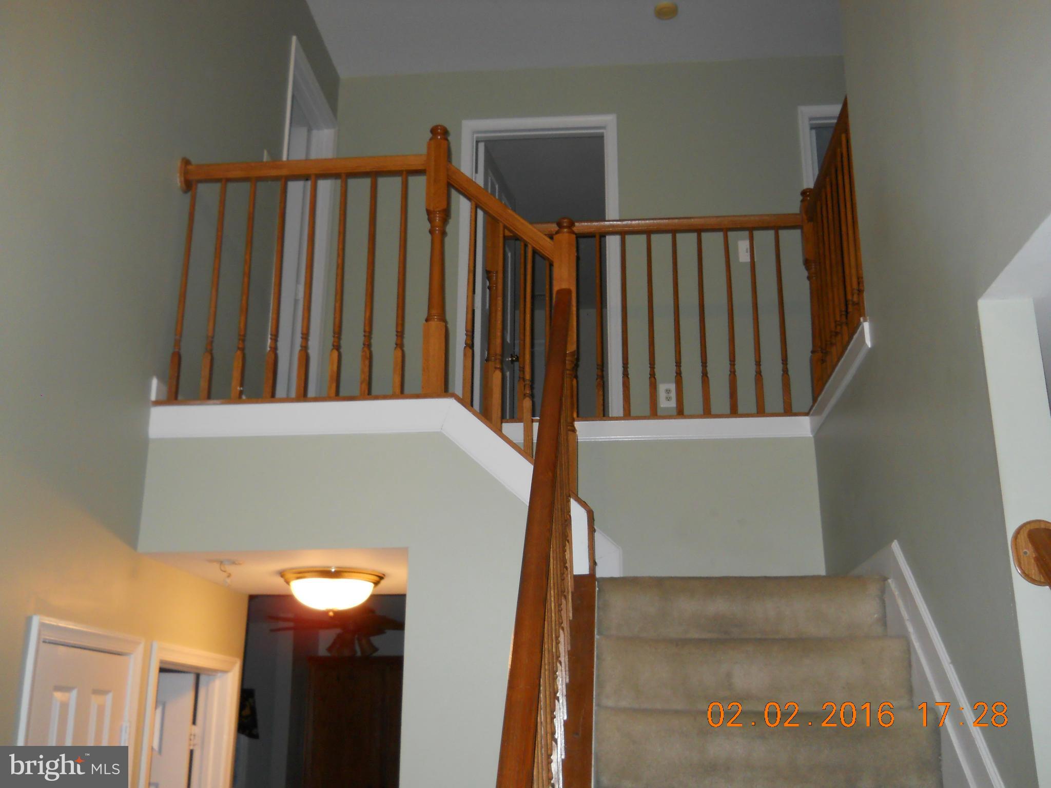 3405 Evans Road Huntingtown, MD 20639 - Photo 3 of 16 a view of a staircase