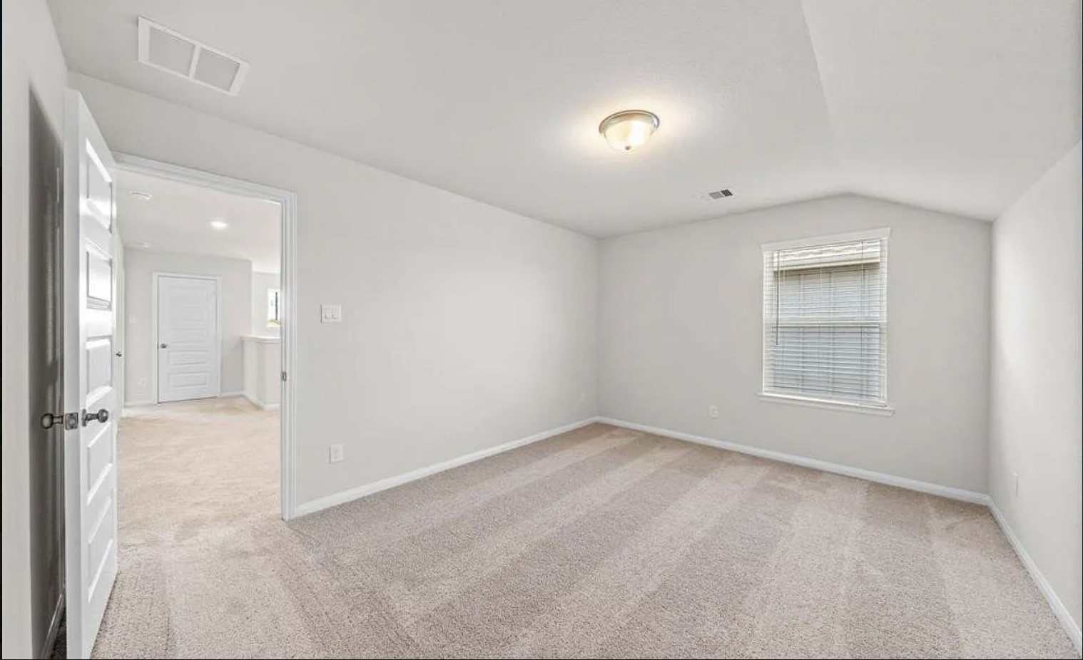 5631 Giving Grace Way Houston, TX 77048 - Photo 8 of 10 a view of an empty room with a window