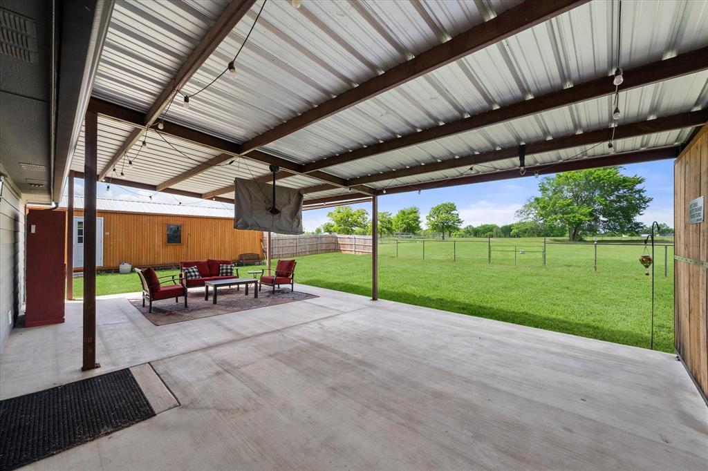 2004 Brown Loop Poolville, TX 76487 - Photo 12 of 36 a view of a backyard with sitting area