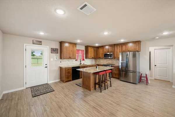 a kitchen with sink and a granite counter top