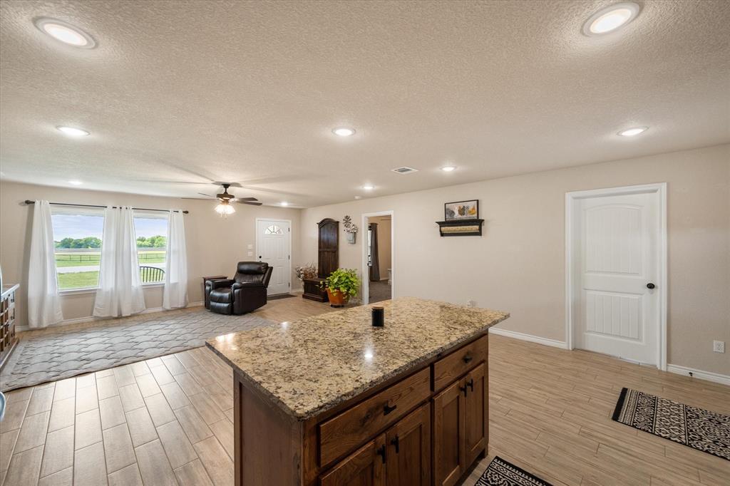 2004 Brown Loop Poolville, TX 76487 - Photo 20 of 36 a kitchen with sink and a granite counter top