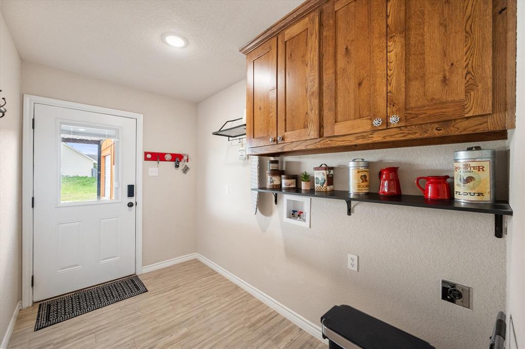 2004 Brown Loop Poolville, TX 76487 - Photo 28 of 36 a room with storage and utility