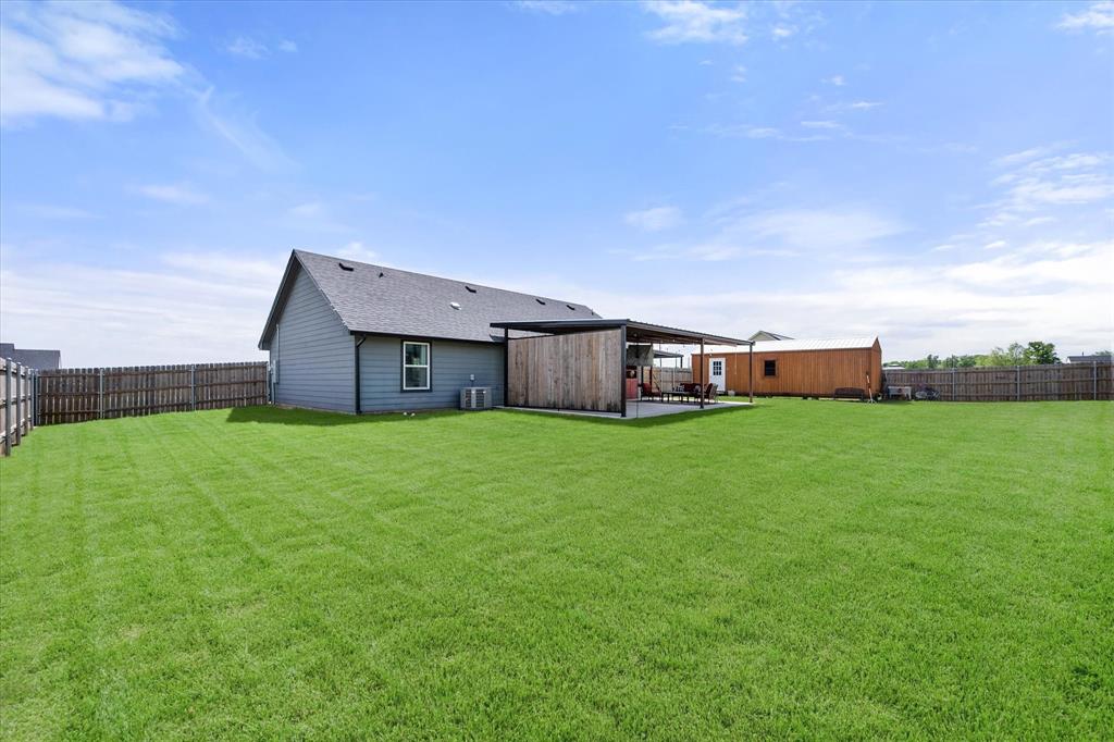 2004 Brown Loop Poolville, TX 76487 - Photo 29 of 36 a front view of house with a garden