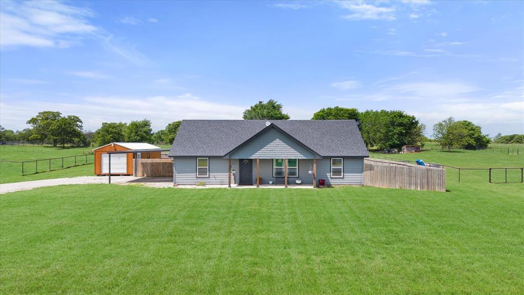 2004 Brown Loop Poolville, TX 76487 - Photo 3 of 36 a house view with a garden space