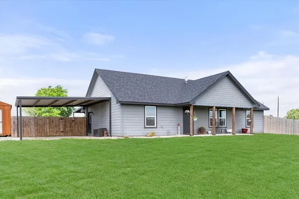 a house view with a garden space