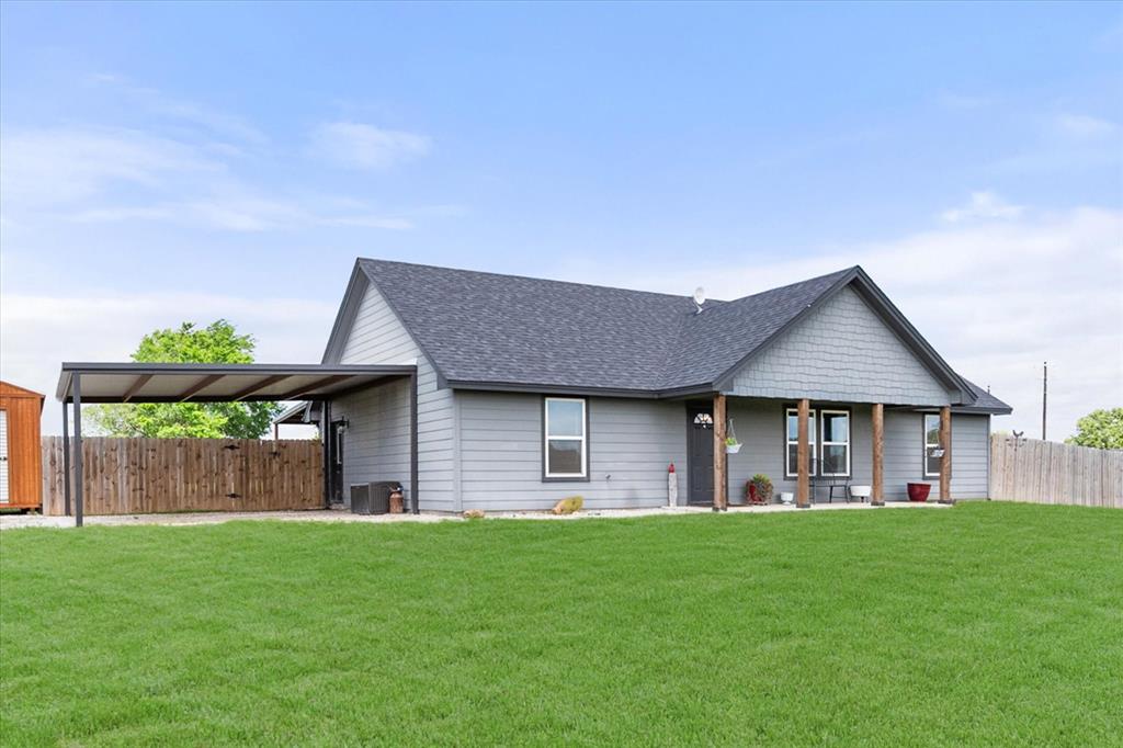 2004 Brown Loop Poolville, TX 76487 - Photo 4 of 36 a front view of house with backyard and green space