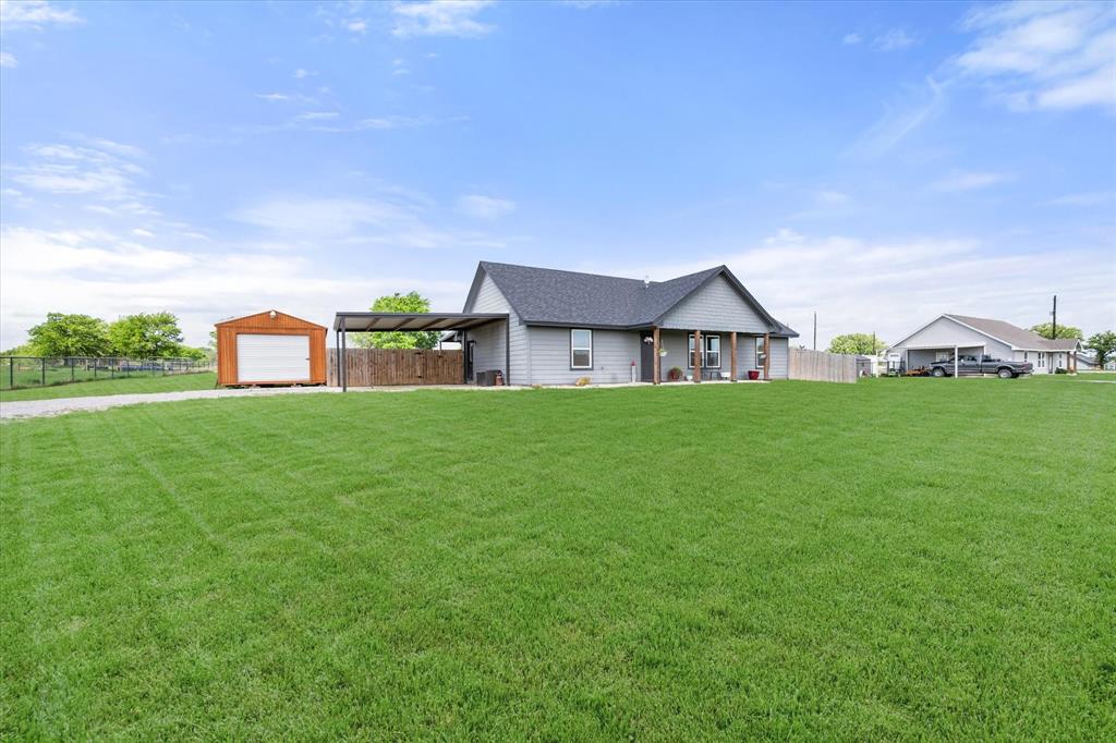 2004 Brown Loop Poolville, TX 76487 - Photo 6 of 36 a house view with a garden space