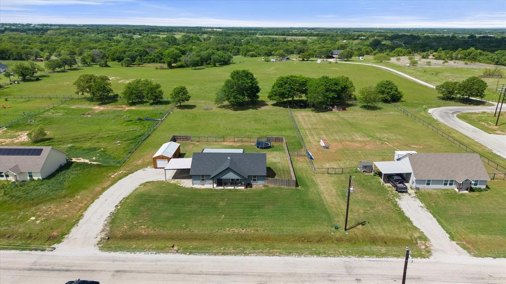 2004 Brown Loop Poolville, TX 76487 - Photo 8 of 36 an aerial view of a house with a big yard