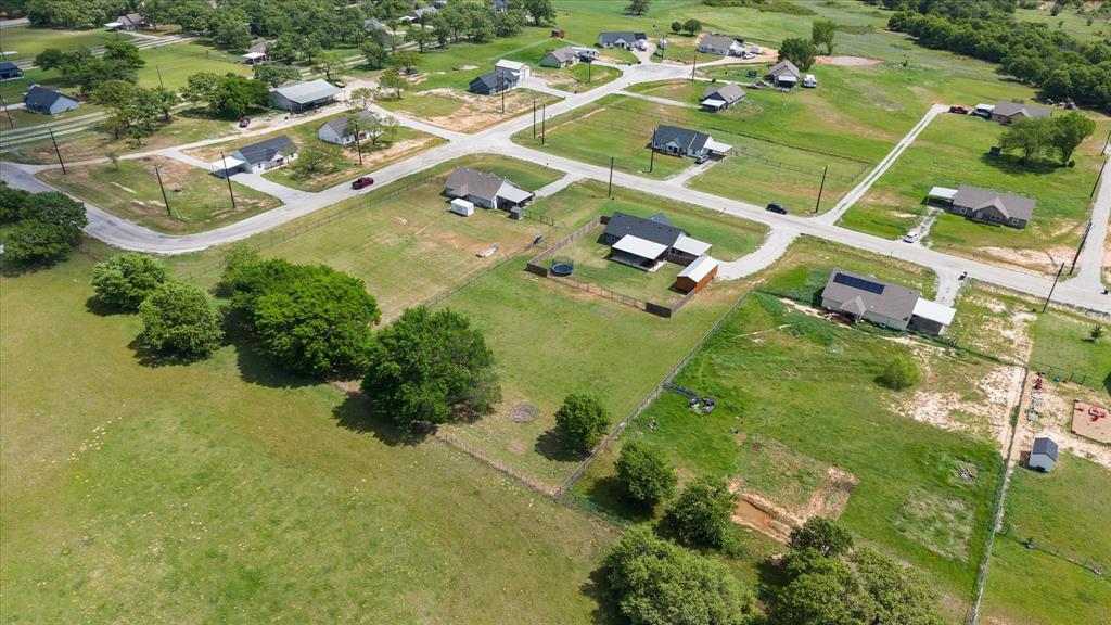 2004 Brown Loop Poolville, TX 76487 - Photo 9 of 36 an aerial view of a residential houses with yard