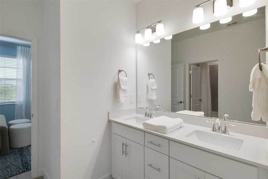 15025 Sea Salt Way Bradenton, FL 34211 - Photo 12 of 64 a bathroom with a sink double vanity and a mirror