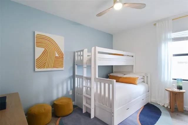 a room with wooden floor and white walls