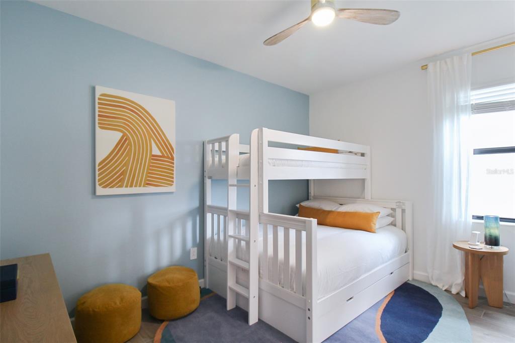 15025 Sea Salt Way Bradenton, FL 34211 - Photo 14 of 64 a bedroom with a bed and a lamp