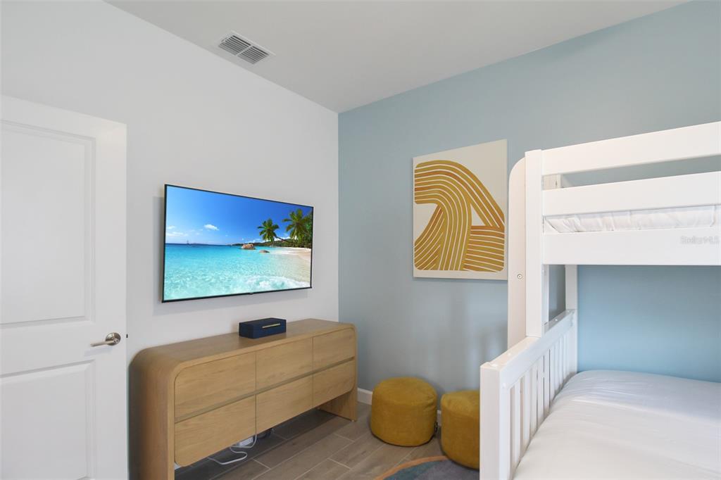 15025 Sea Salt Way Bradenton, FL 34211 - Photo 16 of 64 a bedroom with a bed and a couch