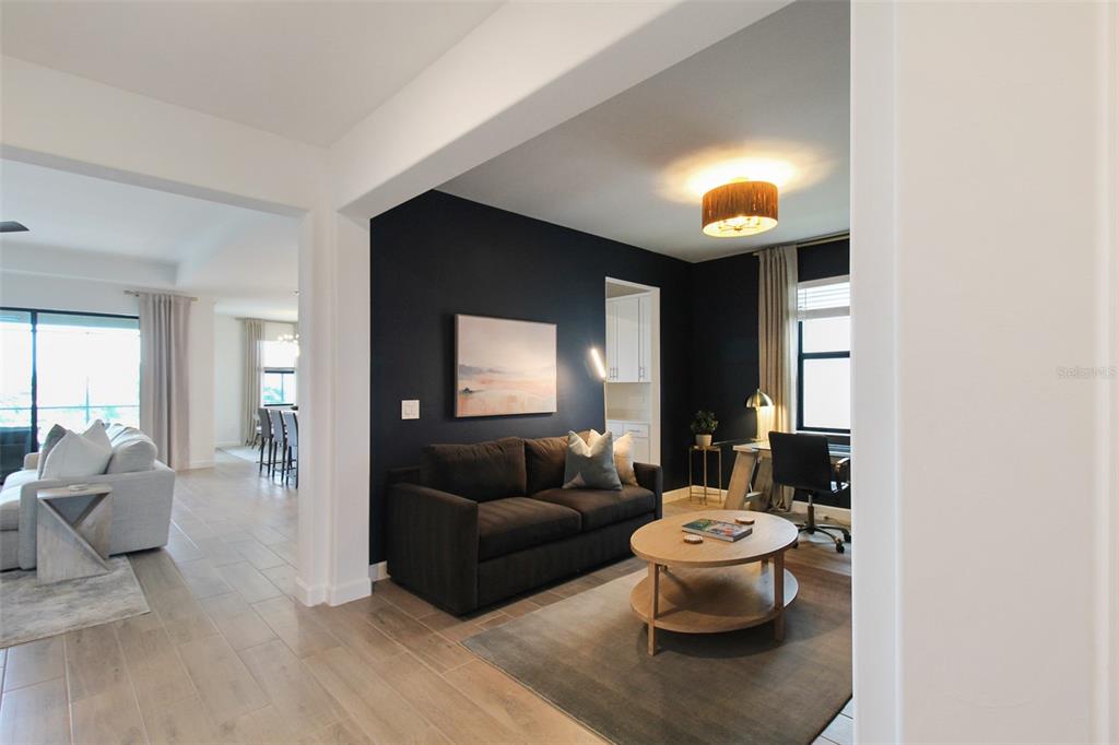 15025 Sea Salt Way Bradenton, FL 34211 - Photo 19 of 64 a living room with furniture and a large window