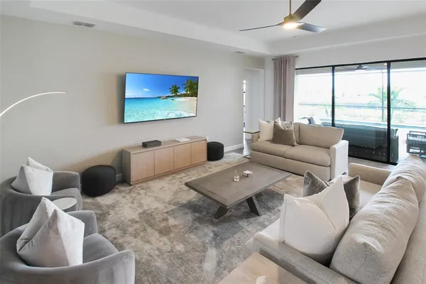 a living room with furniture and a large window