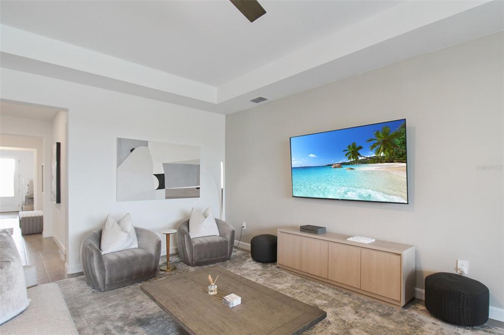 15025 Sea Salt Way Bradenton, FL 34211 - Photo 28 of 64 a living room with furniture and a flat screen tv