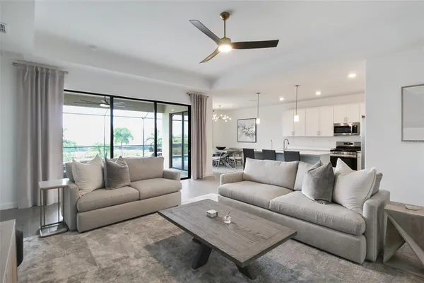 a view of living room with furniture and a flat screen tv