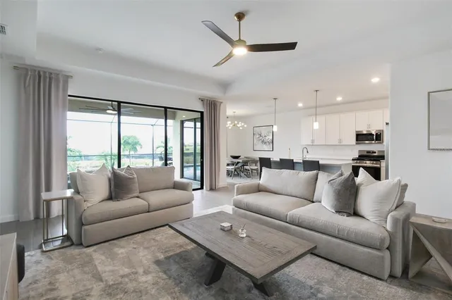 a view of living room with furniture and a flat screen tv