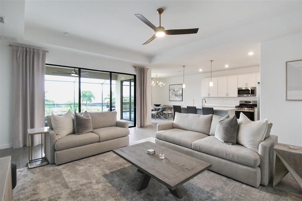 15025 Sea Salt Way Bradenton, FL 34211 - Photo 29 of 64 a living room with furniture and a large window