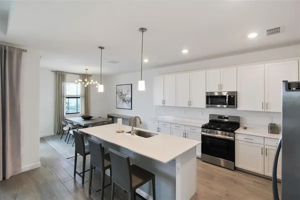 a bedroom with a bed and a lamp