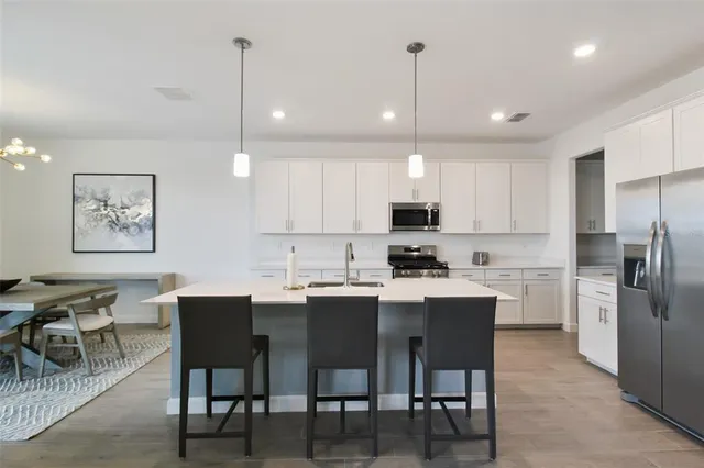 a bedroom with a bed couch and window