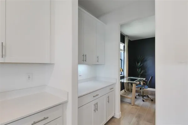 a spacious bathroom with a double vanity sink a mirror and a shower