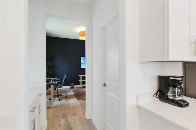a bathroom with a sink a mirror a vanity and a shower