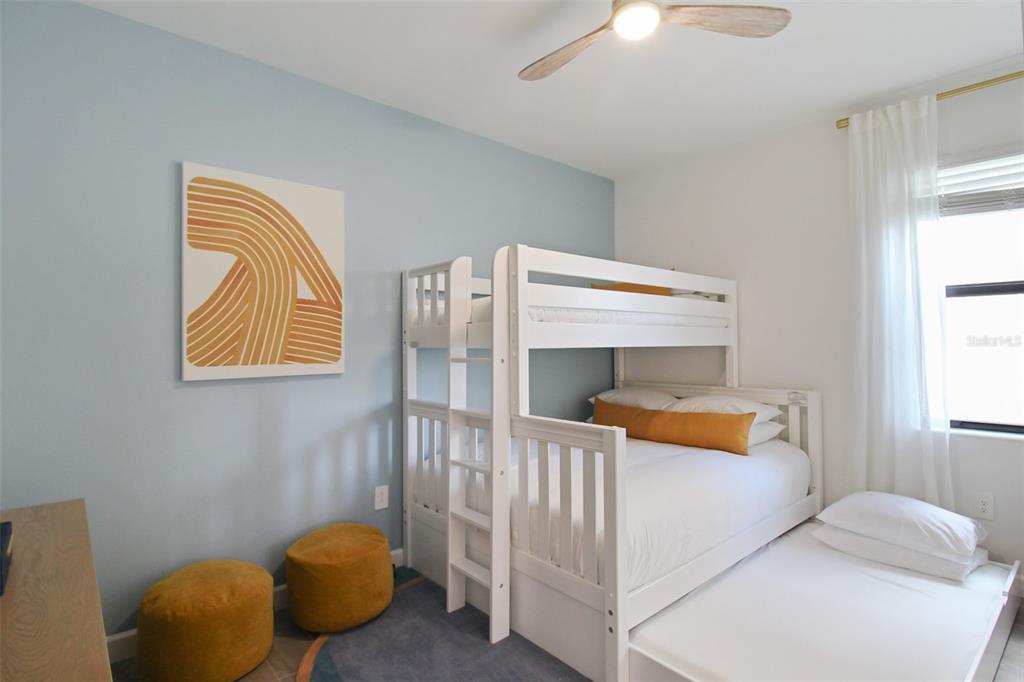 15025 Sea Salt Way Bradenton, FL 34211 - Photo 39 of 64 a bedroom with a bed and a lamp