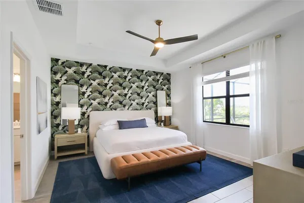 a view of a hallway with two couches and a flat screen tv