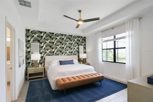 a view of a hallway with two couches and a flat screen tv