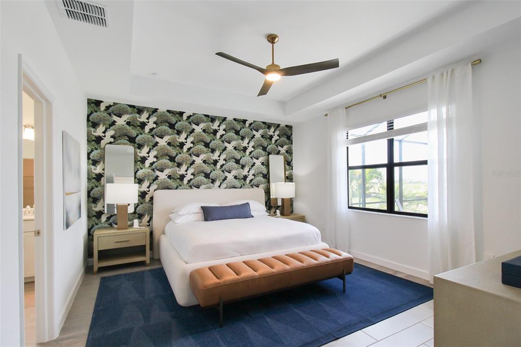 15025 Sea Salt Way Bradenton, FL 34211 - Photo 40 of 64 a bedroom with a bed couch and window